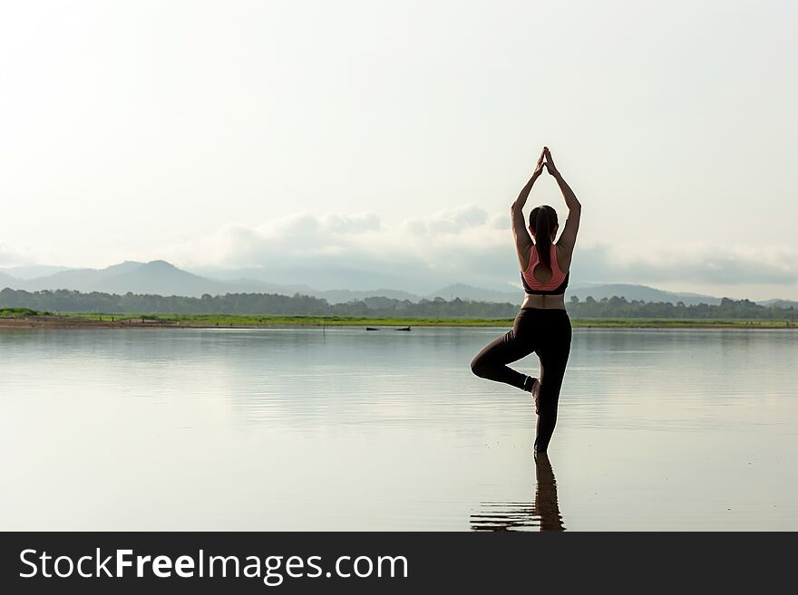 Yoga women lifestyle exercise and pose for healthy life. Young girl or people pose balance body vital zen and meditation for workout sunrise morning nature background. Health care Concept