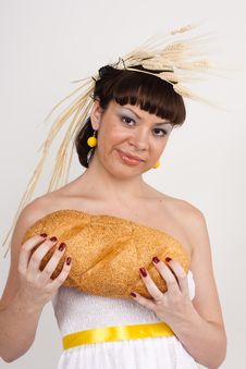 Girl With Bread And Ears Of Wheat Stock Photos