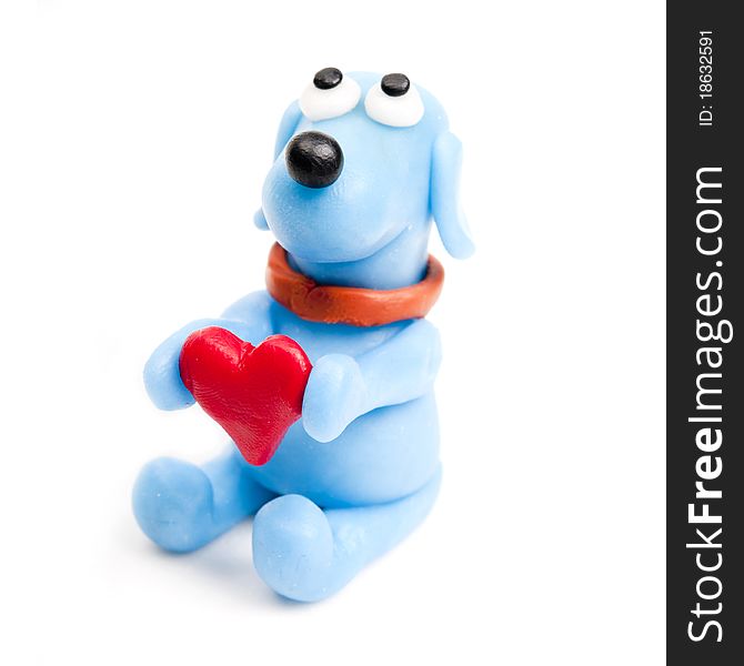Miniature polymer clay blue dog offering his heart. Miniature polymer clay blue dog offering his heart.