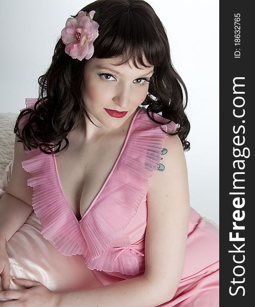 Romantic pinup model in lingerie and hair flower