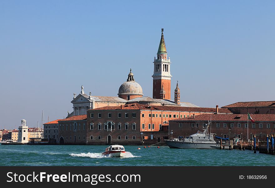 Builidings from San Giogio Maggiore island in Venice Italy, as they can be seen from Tronchetto-Lido di Venezia waterway.In the first plane is the Benedictine San Giorgio Monastery and in the second plane is the Church of San Giorgio Maggiore, designed by the Andrea Palladio.