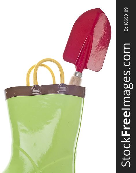 Green Gardening Boots with a Red Garden Shovel Spade.