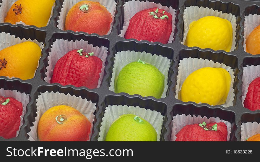 Colorful Marzipan in Fruit Shapes in a Box.