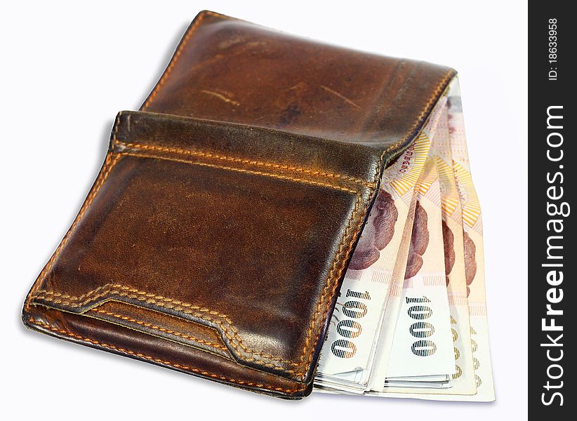 Wallet with money on a white background