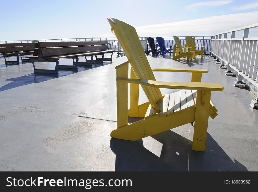 A yellow chair on a  cruise deck. A yellow chair on a  cruise deck.