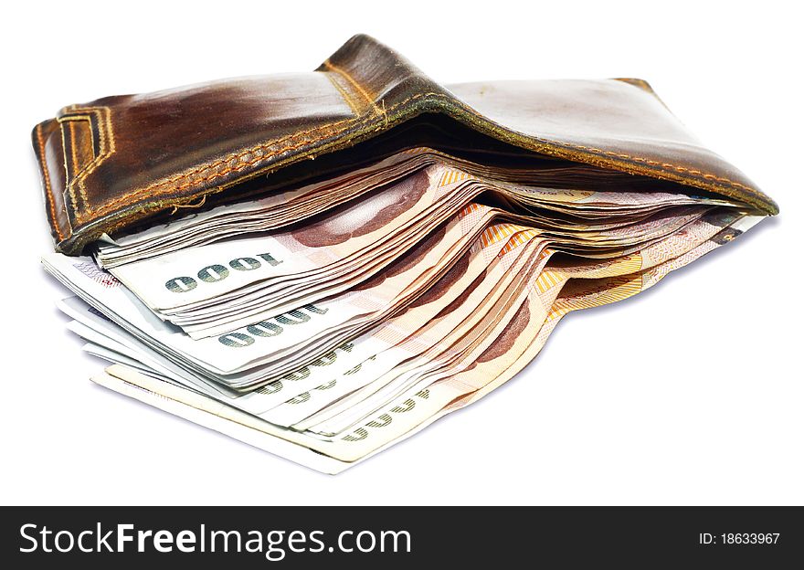 Wallet with money on a white background