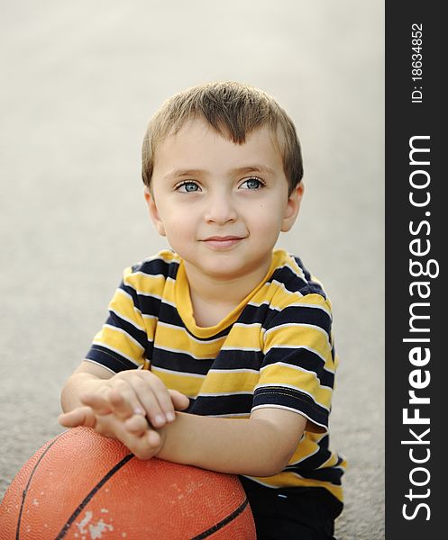 Adorable child holding  the basketball. Adorable child holding  the basketball