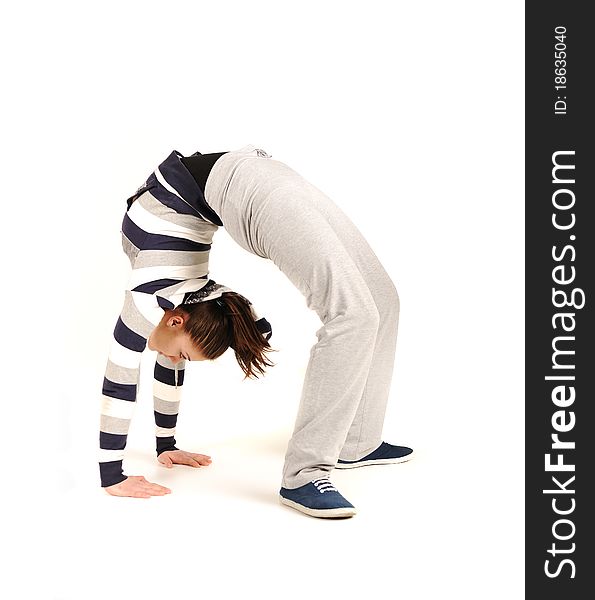 Beautiful young woman makes stretching isolated over white background