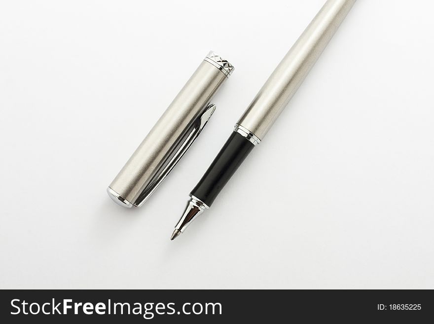 Pen and silver casing. Placed on a white background.
