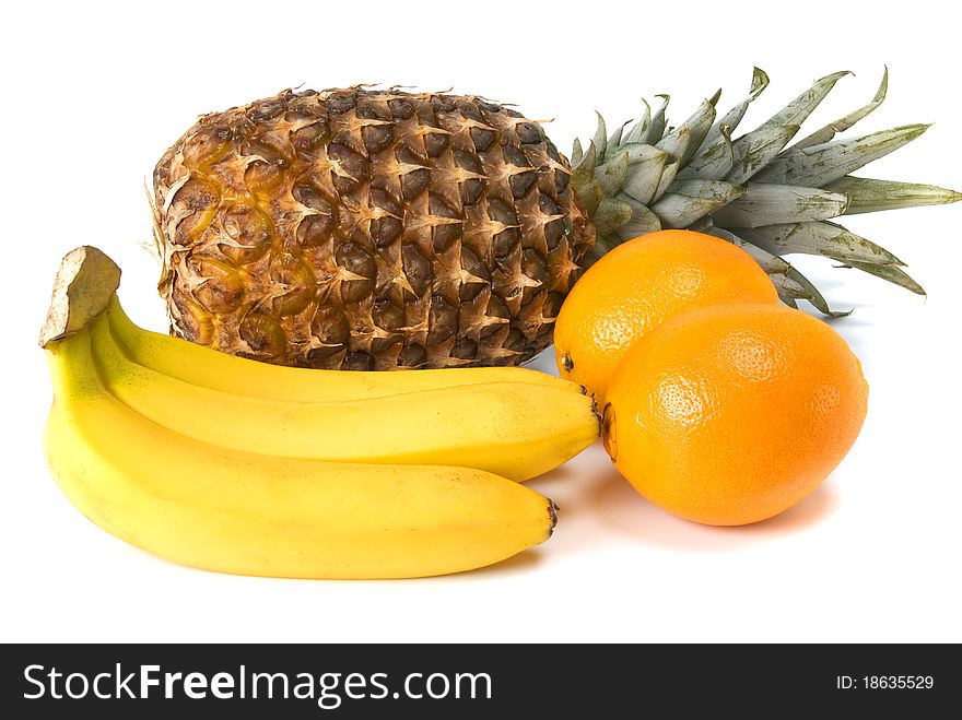 Pineapple, banana and orange on white background. Pineapple, banana and orange on white background