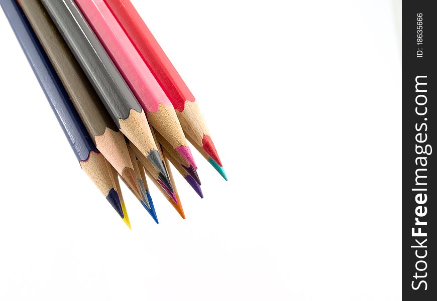 Some color pencils in a bunch on a white background. Some color pencils in a bunch on a white background