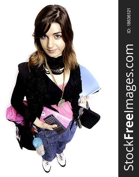 View of a teenager school girl holding books on a white background. View of a teenager school girl holding books on a white background.