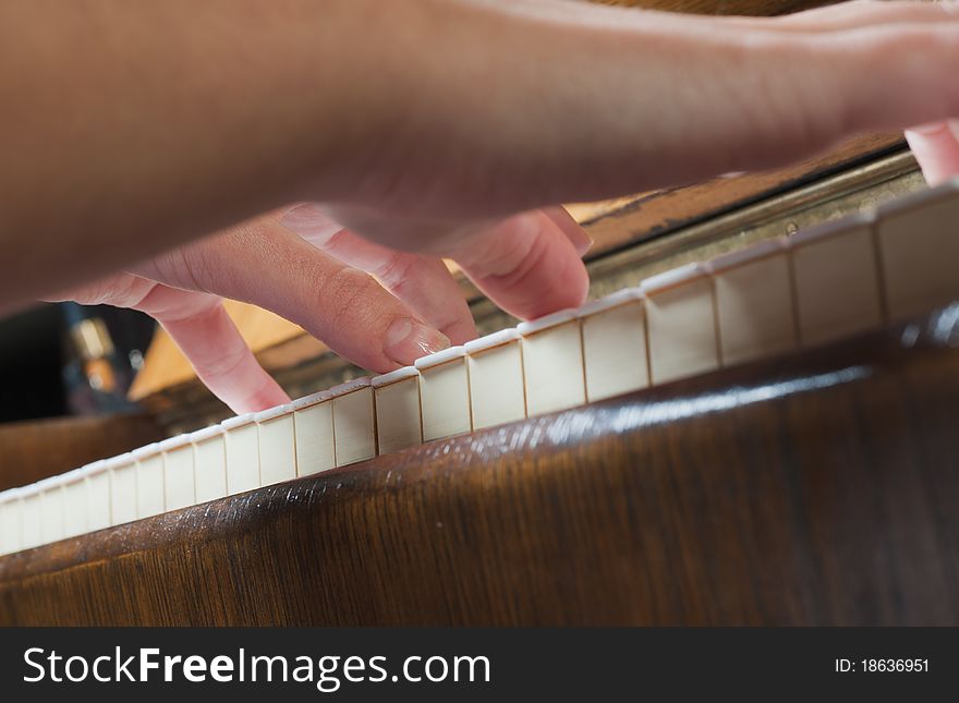 Female hand on a piano. Female hand on a piano