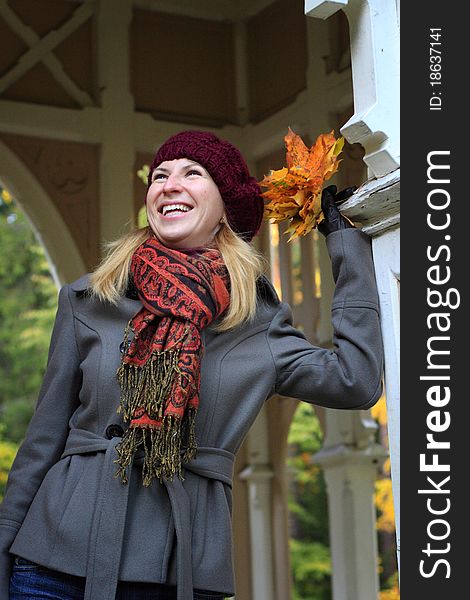 Beautiful young woman is enjoying the atmosphere of colorful autumn in Finland. Beautiful young woman is enjoying the atmosphere of colorful autumn in Finland.