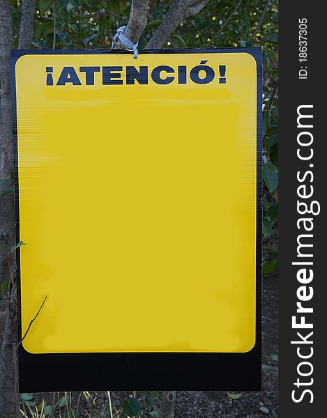 Yellow sign: Attention in park, Spain