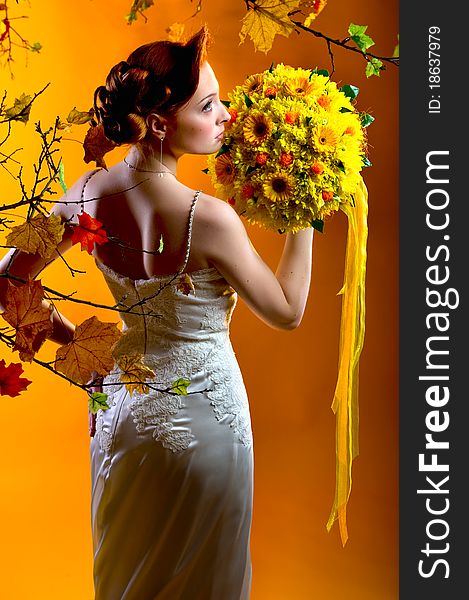 Gorgeous young redhead woman with bouquet of flowers. Gorgeous young redhead woman with bouquet of flowers