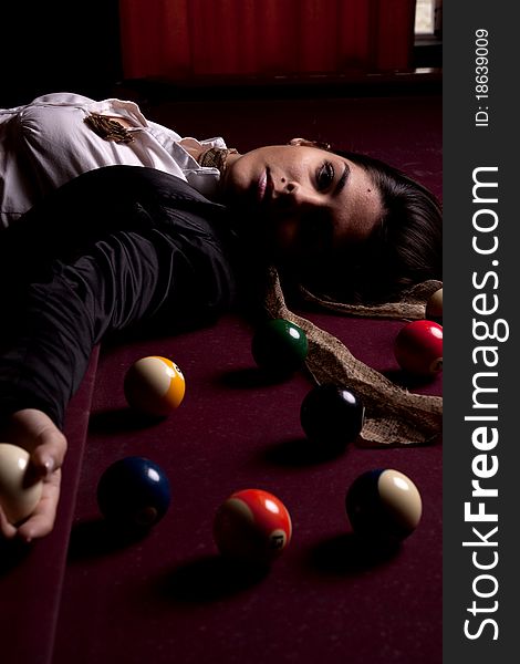 Detail view of a girl next to a snooker table. Detail view of a girl next to a snooker table.