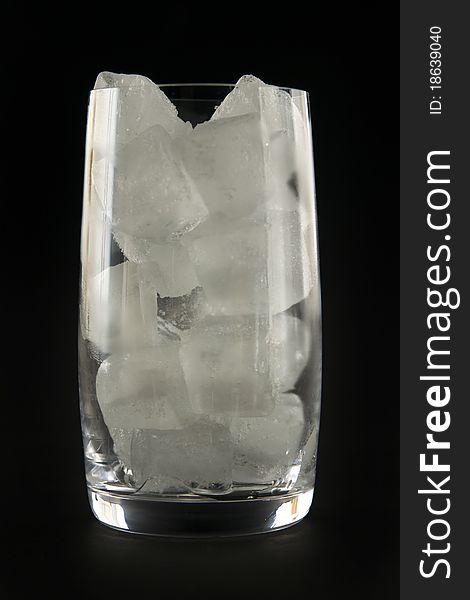 Glass and ice, on black background. Glass and ice, on black background.