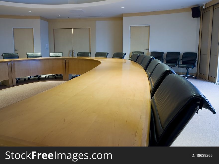 A meeting room full of empty chairs.