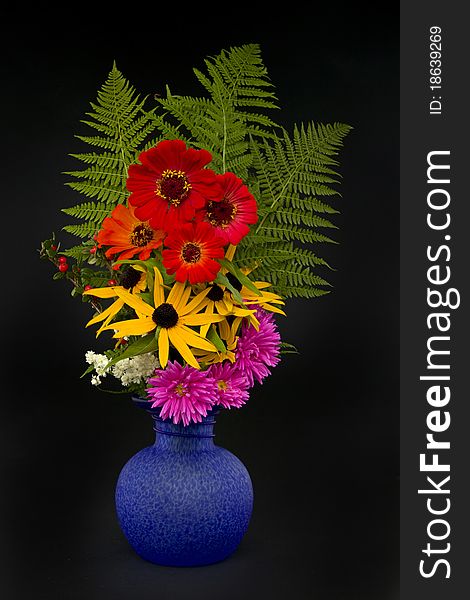 Vase with bouquet on black background. Vase with bouquet on black background.