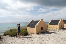 Tourist At Yellow Slave Huts - Bonaire Stock Photos Tourist At Yellow Slave Huts - Bonaire Stock Photos