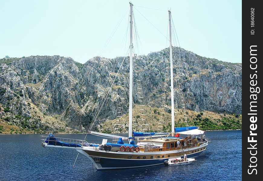 Yacht in aegean sea among mountains turkey