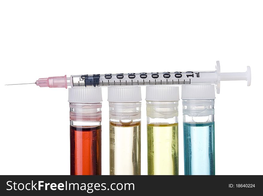 Syringe and test tubes on a white background. Syringe and test tubes on a white background.