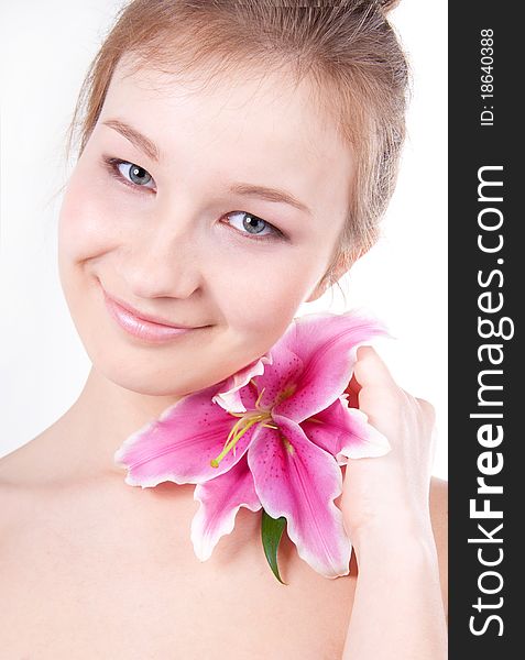 Close-up studio portrait of beautiful young woman with lily flower. Close-up studio portrait of beautiful young woman with lily flower