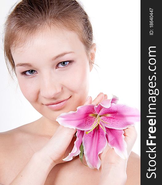 Close-up studio portrait of beautiful young woman with lily flower. Close-up studio portrait of beautiful young woman with lily flower