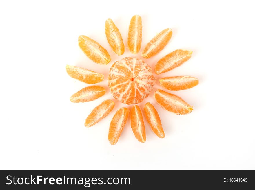 Slices of fresh orange representing sun with beams isolated on white. Slices of fresh orange representing sun with beams isolated on white