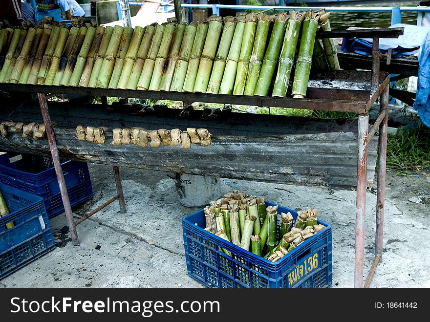 Glutinous rice baked in a bamboo cylinder in the market , Thailand. Glutinous rice baked in a bamboo cylinder in the market , Thailand.