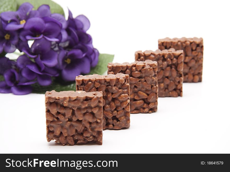 Punch twig with chocolate and bunch of flowers