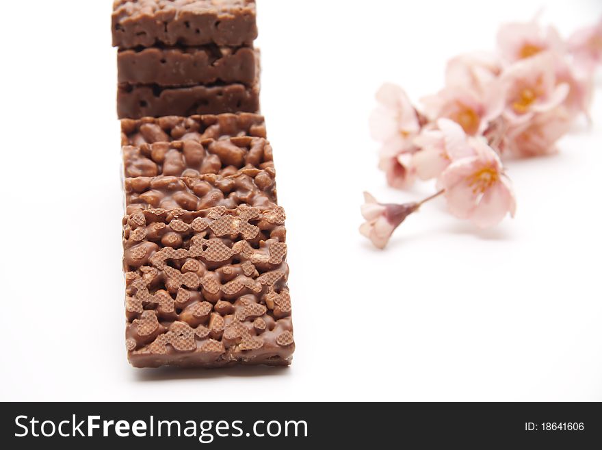 Punch twig with chocolate and flower branch. Punch twig with chocolate and flower branch