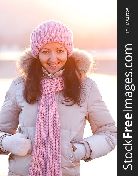 Positive smiling girl in winter clothes