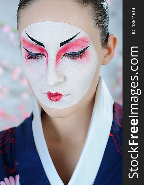 Japan geisha woman with creative make-up.close-up artistic portrait