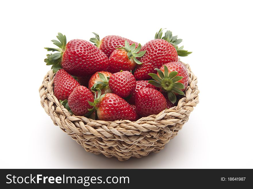 Strawberries in the woven basket. Strawberries in the woven basket