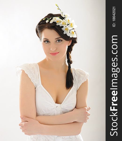 Beautiful fresh spring woman with flowers in her hair