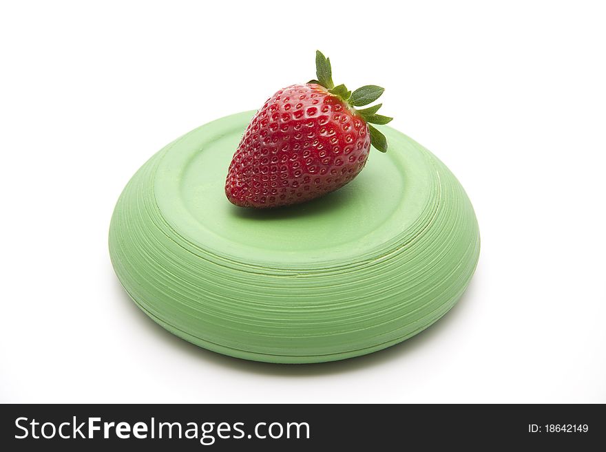 Strawberry onto green ceramic plate
