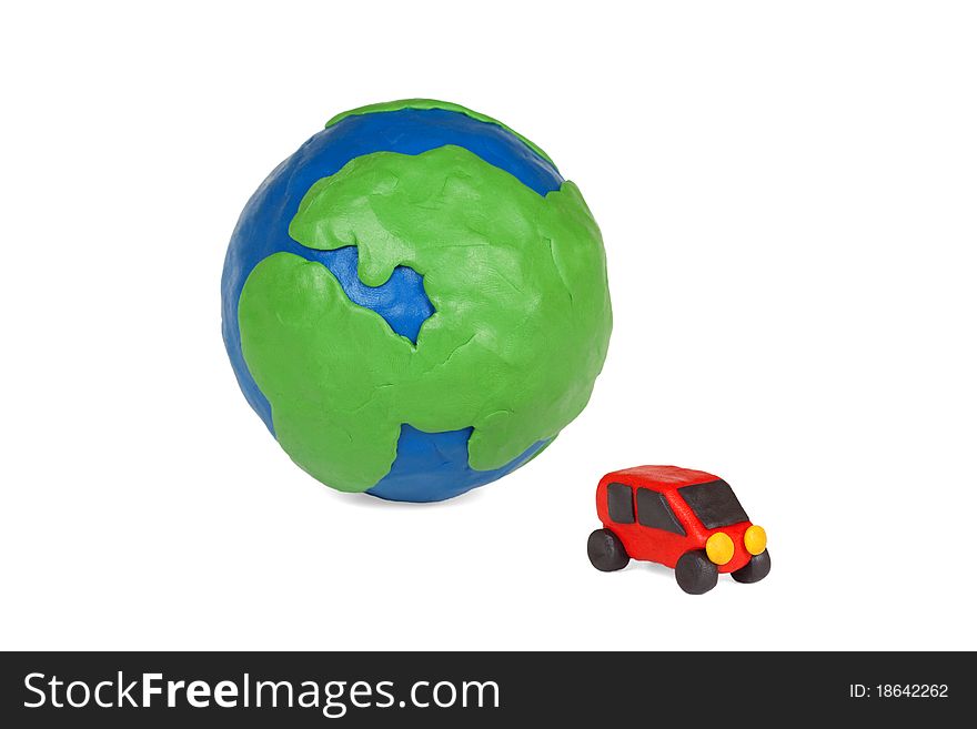 Plasticine globe and a car on a white background. Plasticine globe and a car on a white background