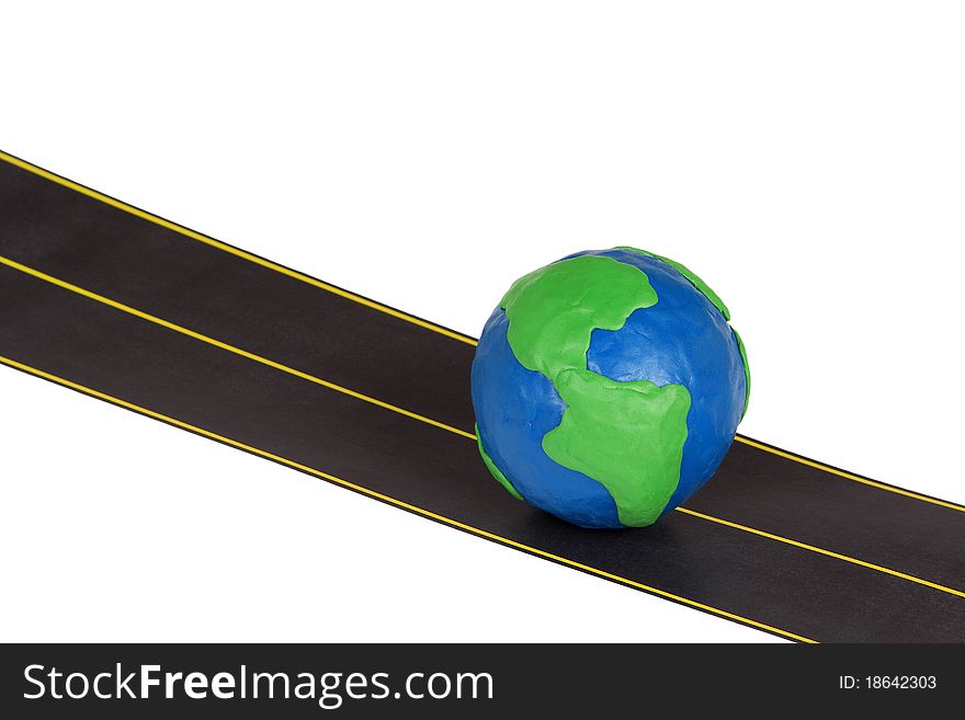 Plasticine model of earth and automobile highway. Plasticine model of earth and automobile highway