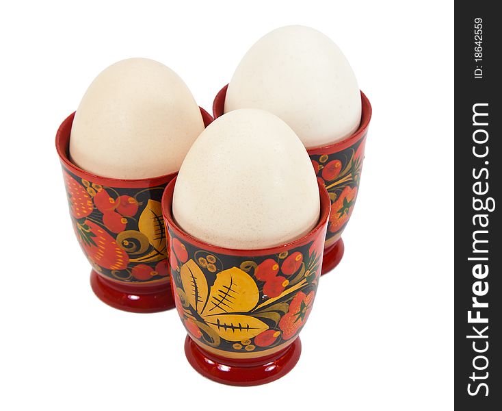 An organic free-range egg in a color egg cups