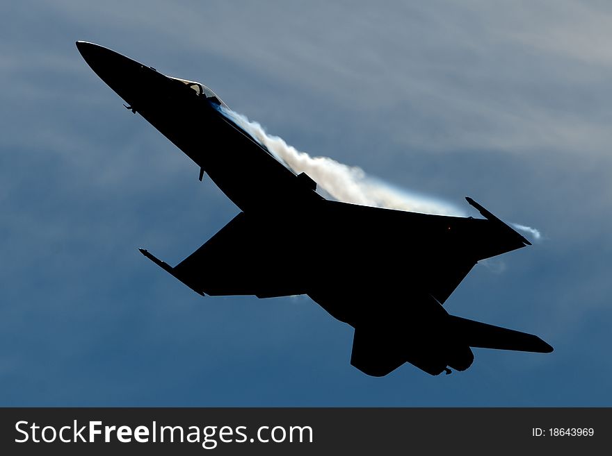 F18 fighter jet performing a high G's pull up