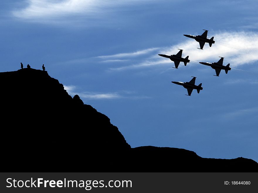 Fighter jet flying in close formation near the mountains. Fighter jet flying in close formation near the mountains