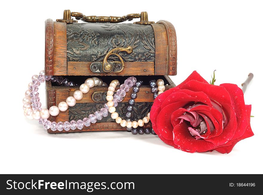 Wooden chest with pearls and red rose , isolated on white. Wooden chest with pearls and red rose , isolated on white