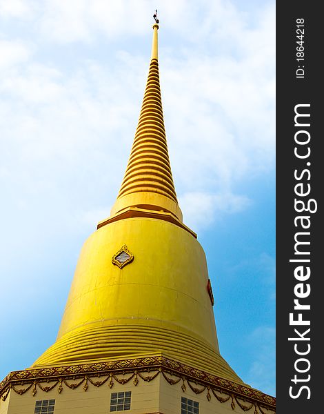 Holy Thai golden pagoda with blue sky