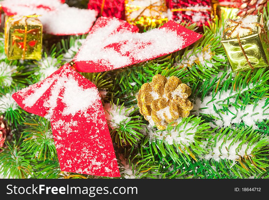 Green branches of a Christmas tree with toys