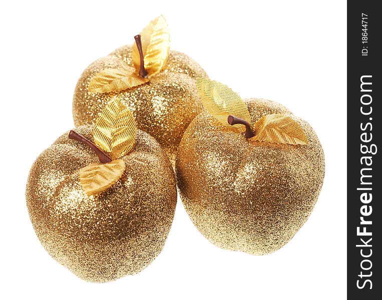 Golden apple lying on a white background