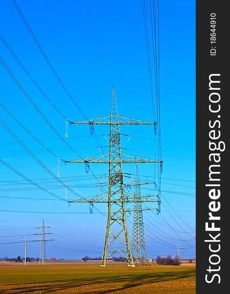 High voltage tower on a background with sky