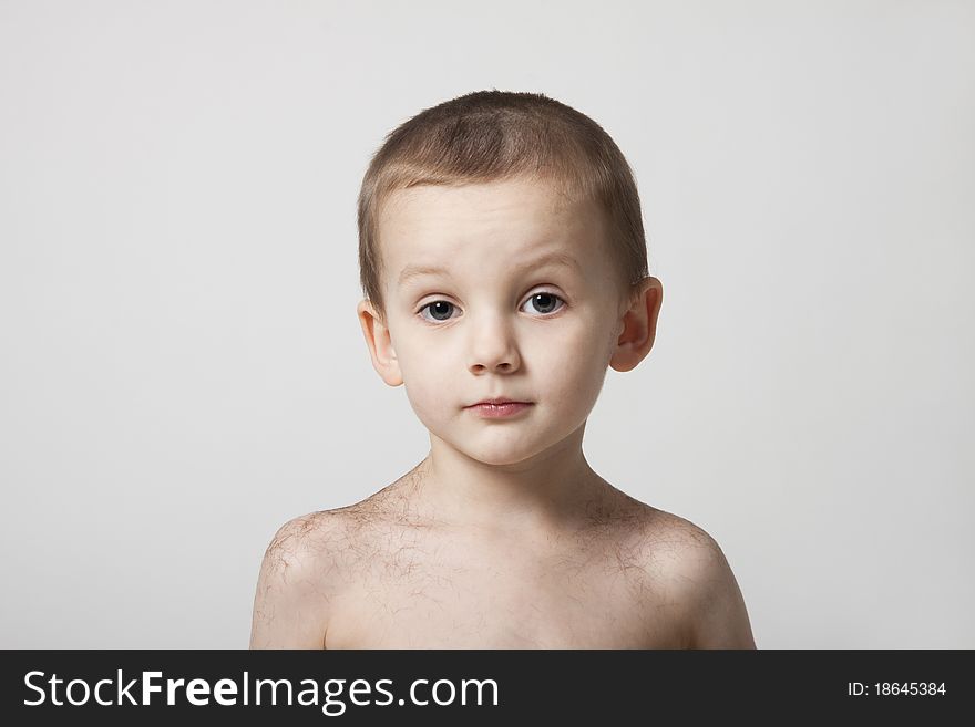 Portrait Of Cute Boy Changing Haircut