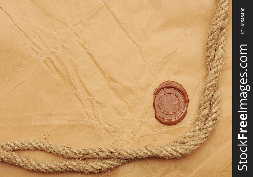 Seal wax and rope on old paper background